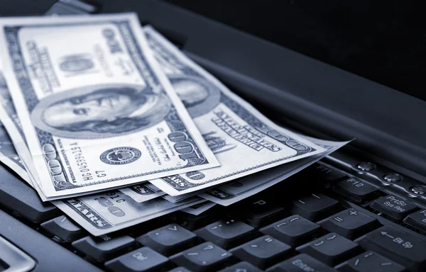American dollars laying on laptop — Stock Photo, Image