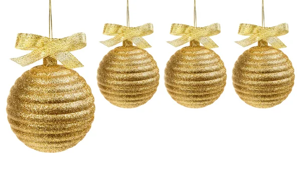 Чотири золоті різдвяні кульки — стокове фото