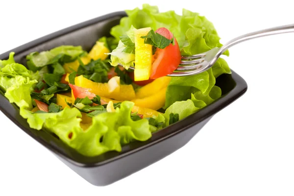 Bowl of fresh salad and fork — Stock Photo, Image