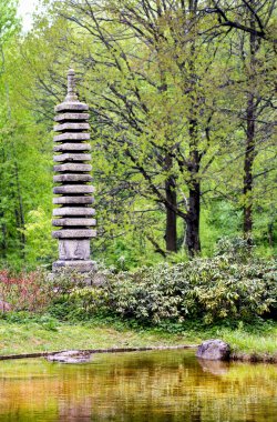 Granite pagoda in japanese garden clipart