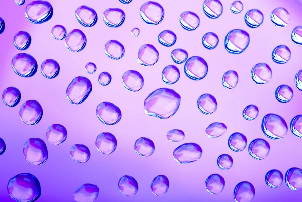 Rosa och blått vatten droppar bakgrund — Stockfoto