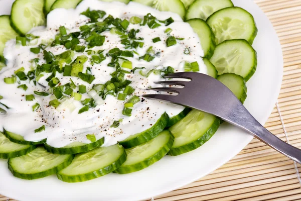 stock image Fresh cucumber slices with sour cream