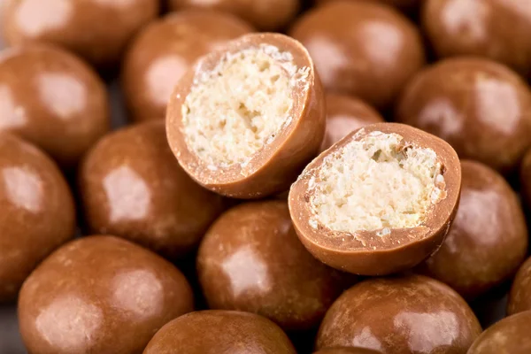 Chocolate balls and halves — Stock Photo, Image