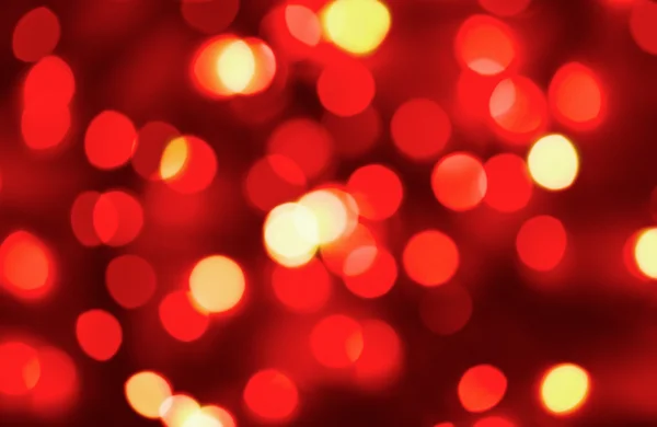 Luci natalizie rosse sfocate — Foto Stock