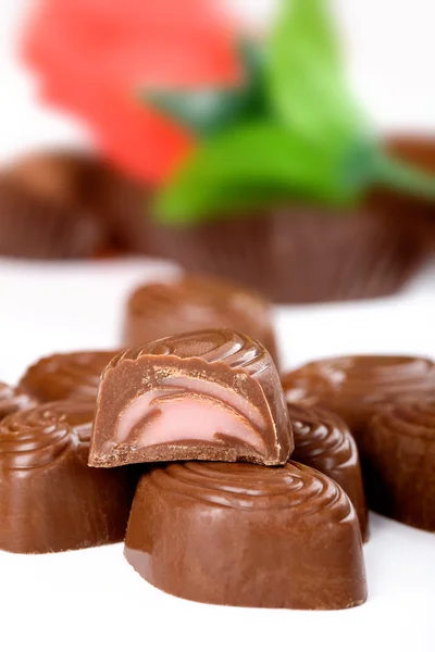 Chocolate candies and half — Stock Photo, Image