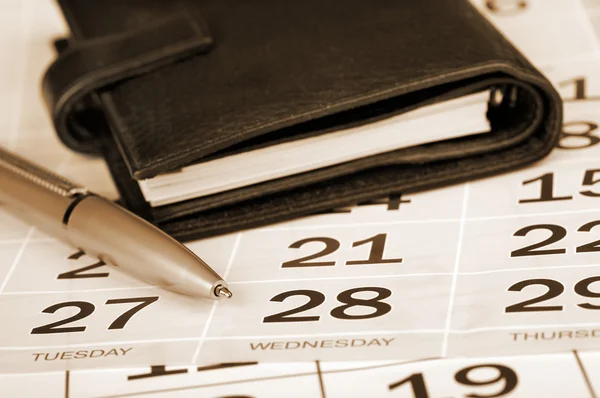 Calendário página, caneta e bolso planejador — Fotografia de Stock