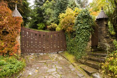 Wooden retro style gate to a house clipart