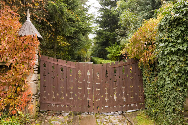 Wooden retro style gate to a house