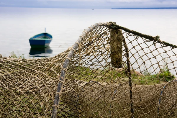 Fishing nets drying on shore — Stock Photo, Image