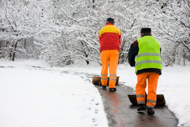 Workers removing first snow clipart