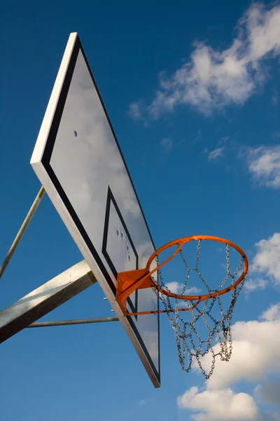 stock image Basketball hoop over blue sky