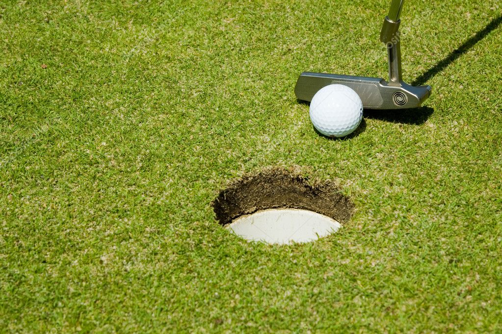 Putting golf ball to a hole — Stock Photo © olechowski #2527351