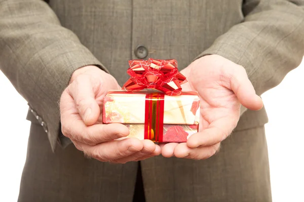 Red gift in hands — Stock Photo, Image