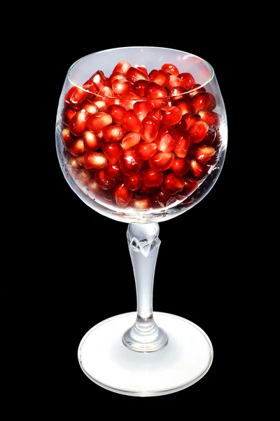 Pomegranate grains in a glass — Stock Photo, Image