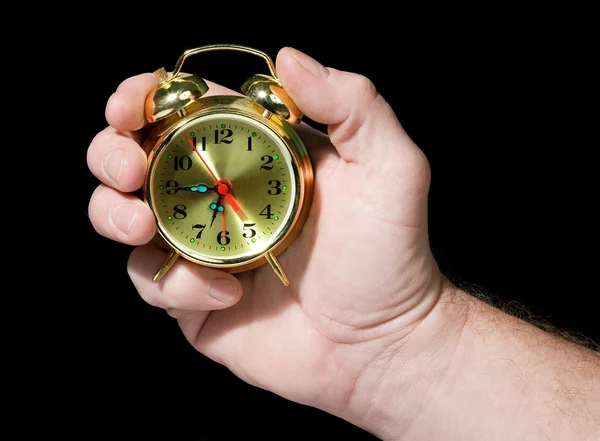 Relógio de alarme em uma mão — Fotografia de Stock