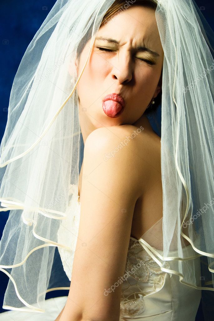 Capricious bride showing her tongue