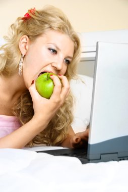 Pretty girl with a laptop clipart