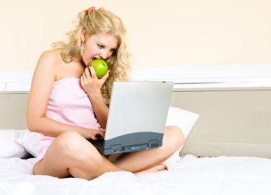 Pretty woman with a laptop clipart