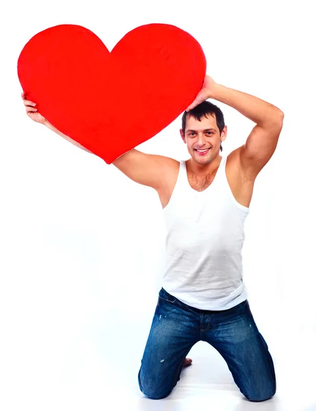 Young man with a heart — Stock Photo, Image
