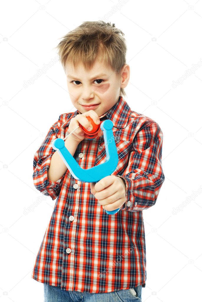 Little boy with a slingshot