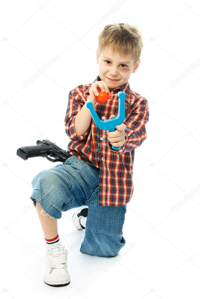 Little boy with a slingshot