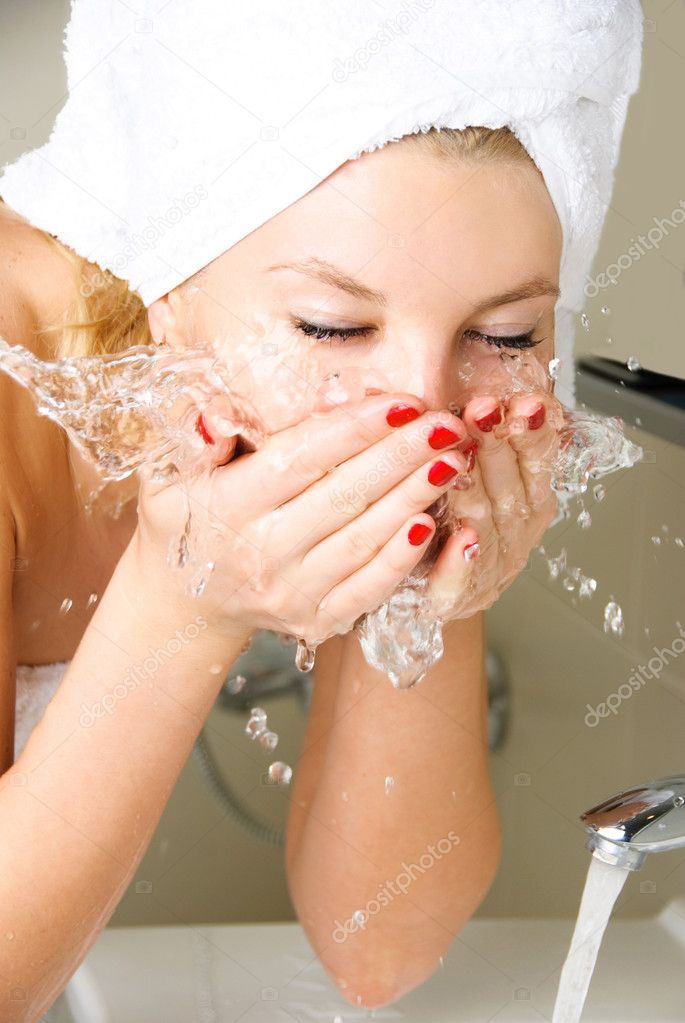 Girl washing her face