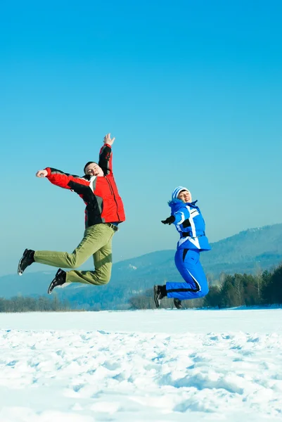 Happy jumping couple — Stock Photo, Image