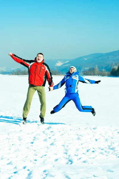 Happy jumping couple — Stock Photo, Image