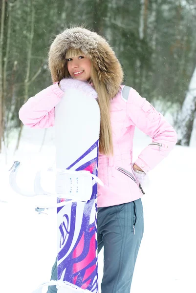Femme avec un snowboard — Photo