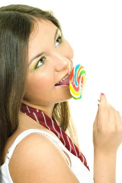 Hezká dívka jíst bonbóny — Stock fotografie