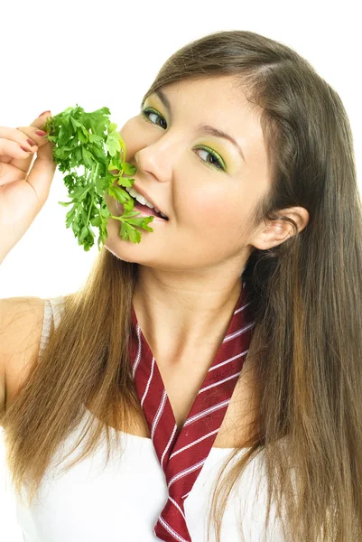 Hezká dívka jíst petržel — Stock fotografie