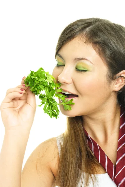 Hezká dívka jíst petržel — Stock fotografie