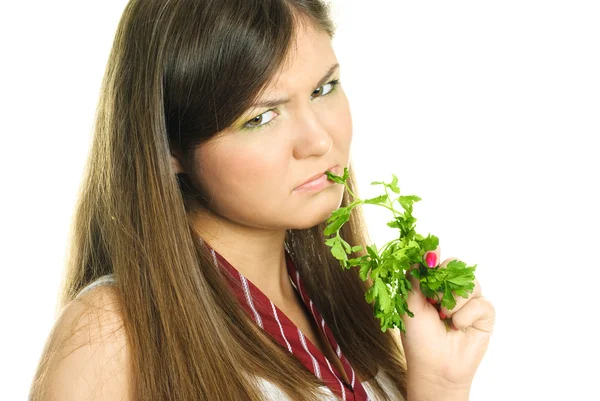 Unglückliches Mädchen isst grüne Petersilie — Stockfoto