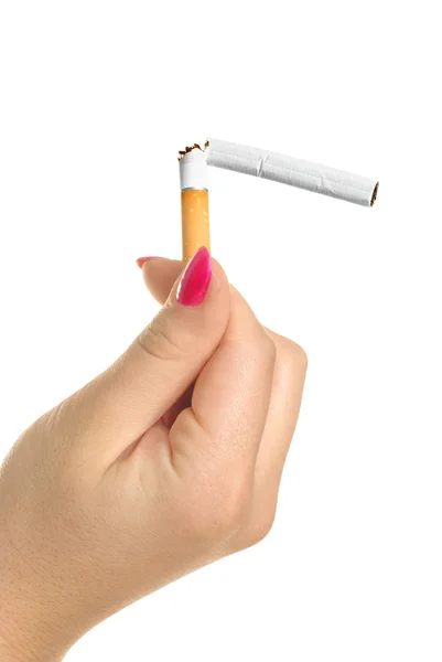 Mão com um cigarro partido — Fotografia de Stock