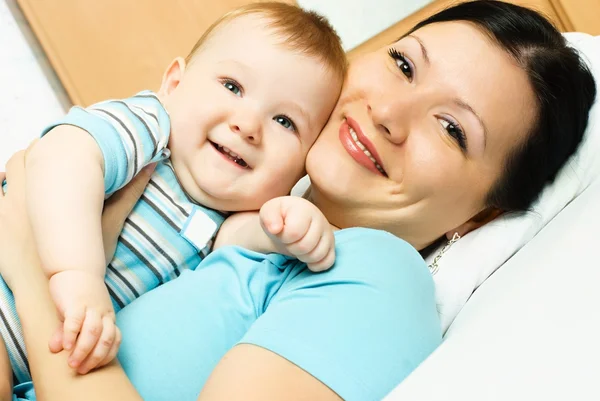 Mother and baby on the bed — Stock Photo, Image