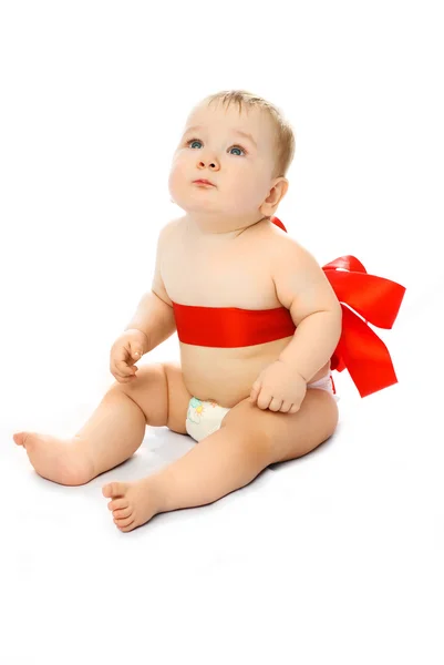 Bebê com uma fita vermelha — Fotografia de Stock
