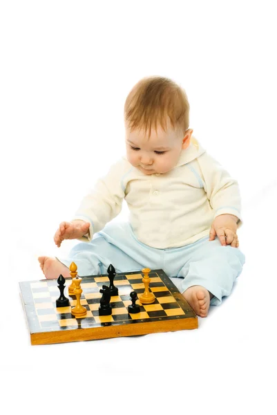 Cute baby playing chess — Stock Photo, Image