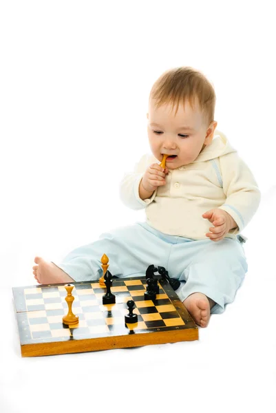 Cute baby playing chess — Stock Photo, Image