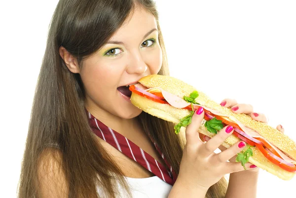Ładna dziewczynka jedzenie hot doga Zdjęcie Stockowe