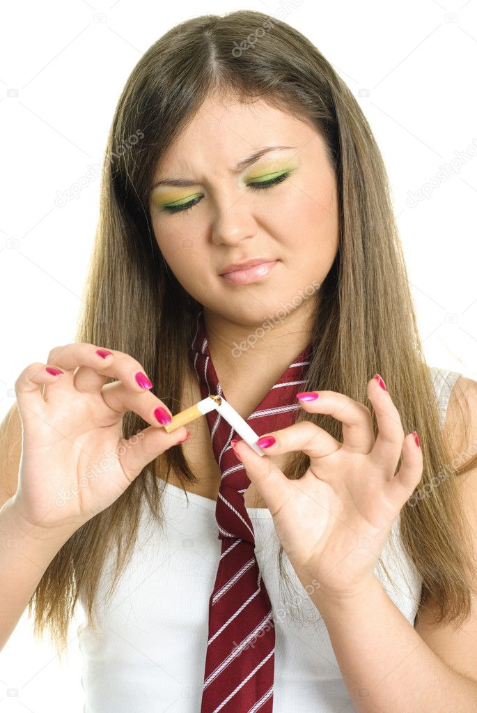 Girl breaking a cigarette