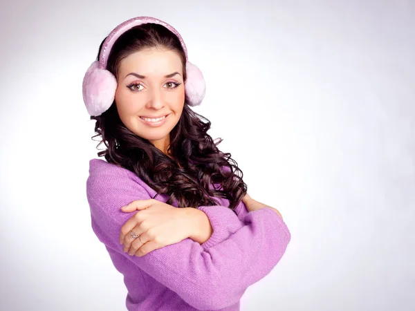 Söt flicka med hörselkåpan — Stockfoto