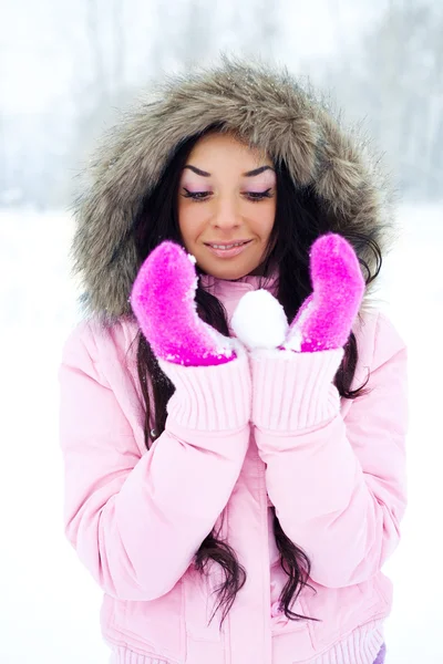 Girl with a snowball Royalty Free Stock Images