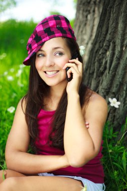 Girl talking on the cellphone clipart