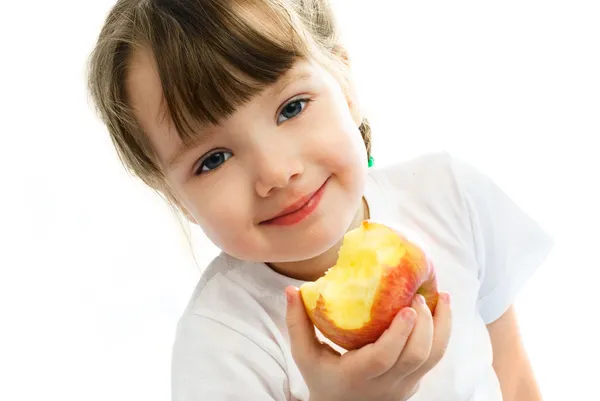 Bambina che mangia una mela — Foto Stock