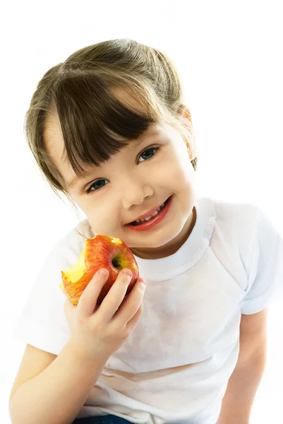 Bambina che mangia una mela — Foto Stock