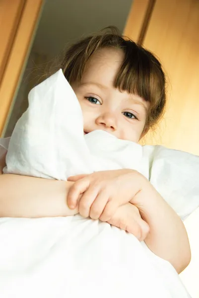 Little girl with a pillow — Stock Photo, Image