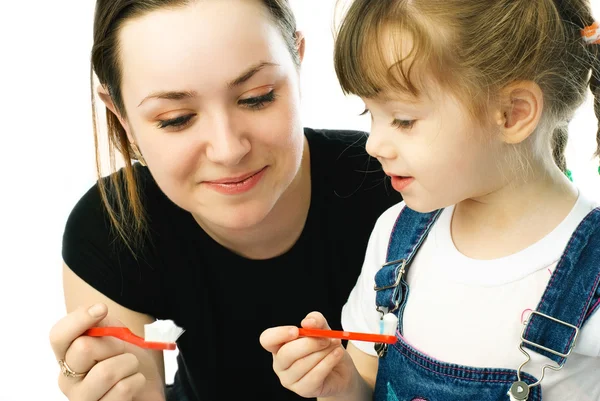 Mother and daughter brushing teeth — Stock Photo, Image