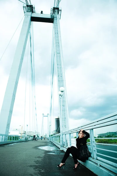 stock image Lonely girl on the bridge