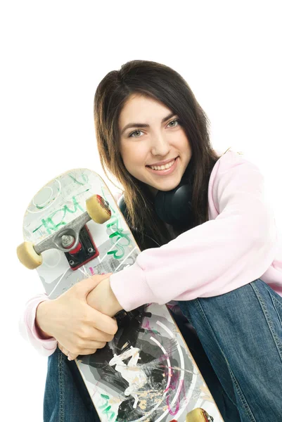 Teenage girl with a skate board — Stock Photo, Image