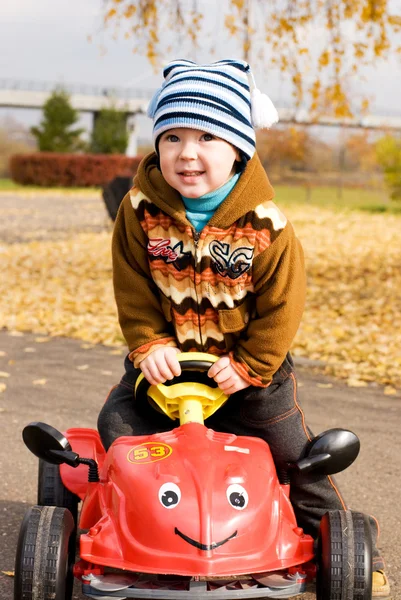 Boy playing with his car — Stock Photo, Image